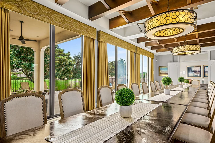 Long dining table and gathering space in an Orlando luxury vacation home