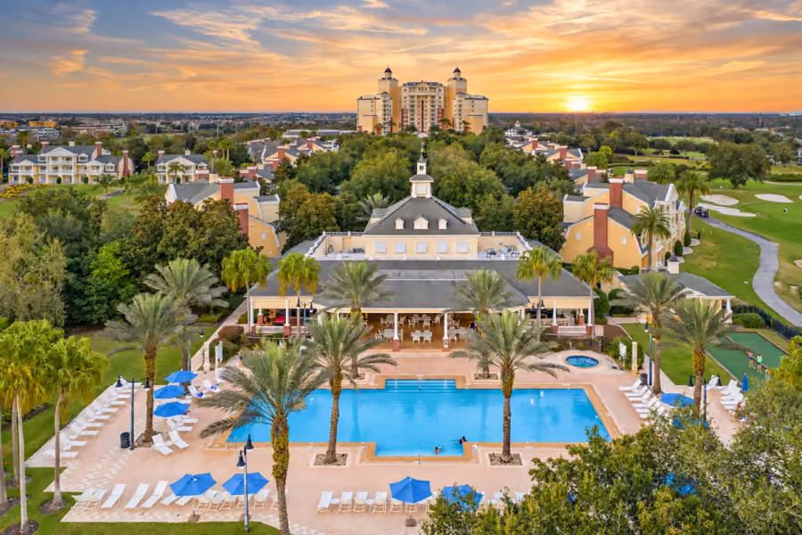 Reunion Resort pool and clubhouse at sunset