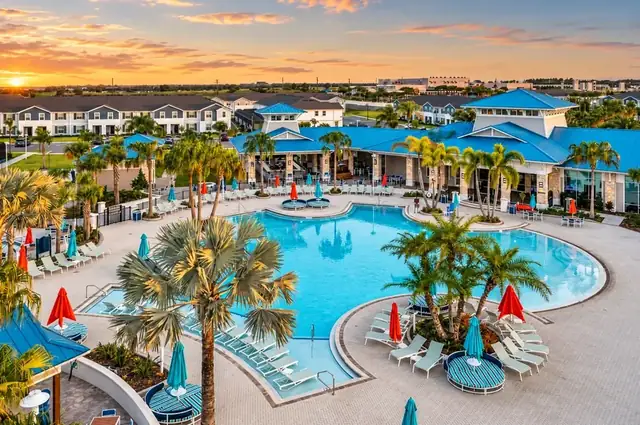 Windsor Island Resort pool and clubhouse at sunset